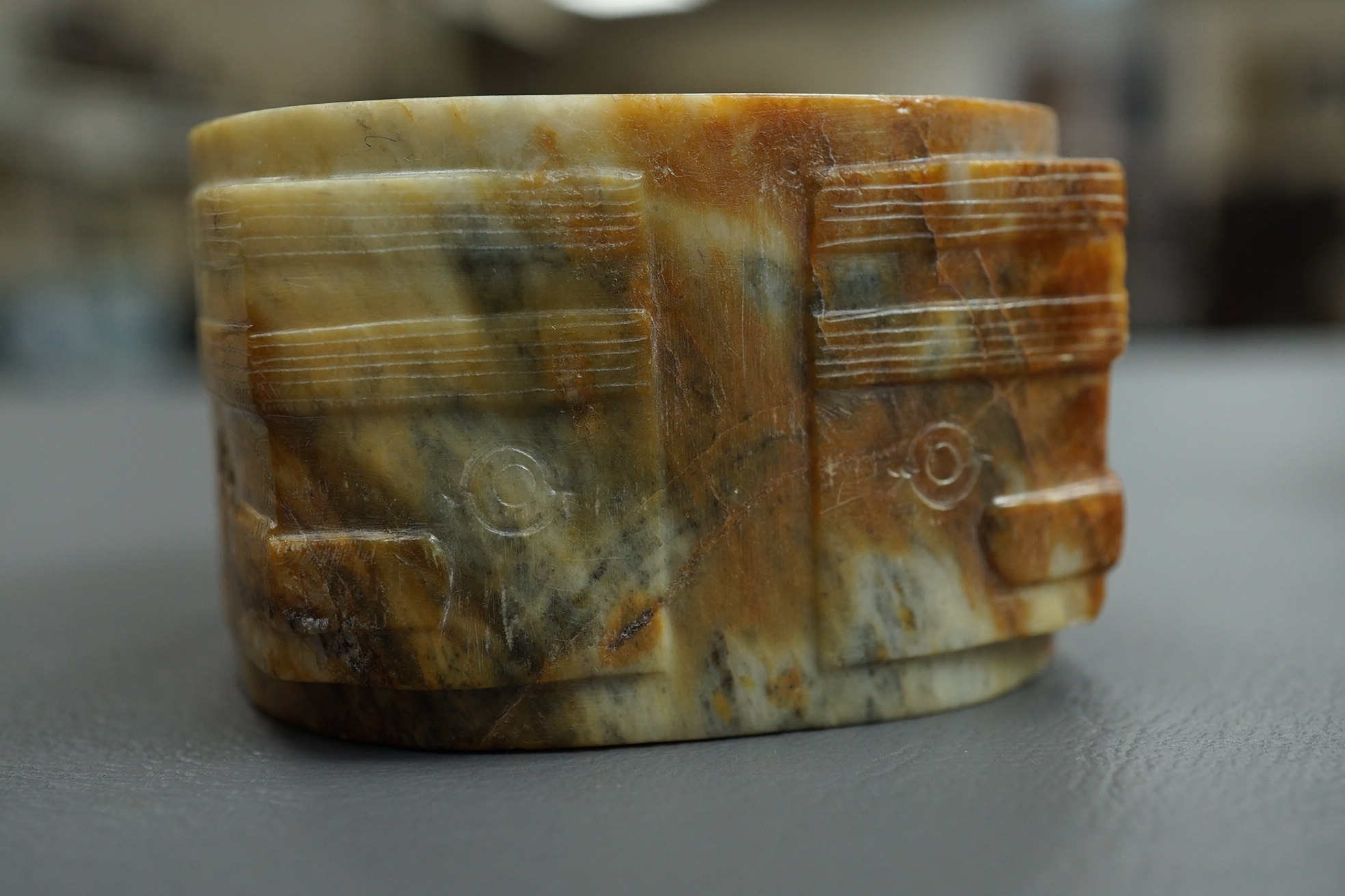 Four Chinese archaistic hardstone or burnt jade cong or cylinders